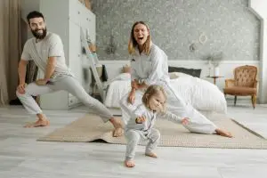 A joyful family engaging in morning stretches together, fostering a fun and healthy routine.